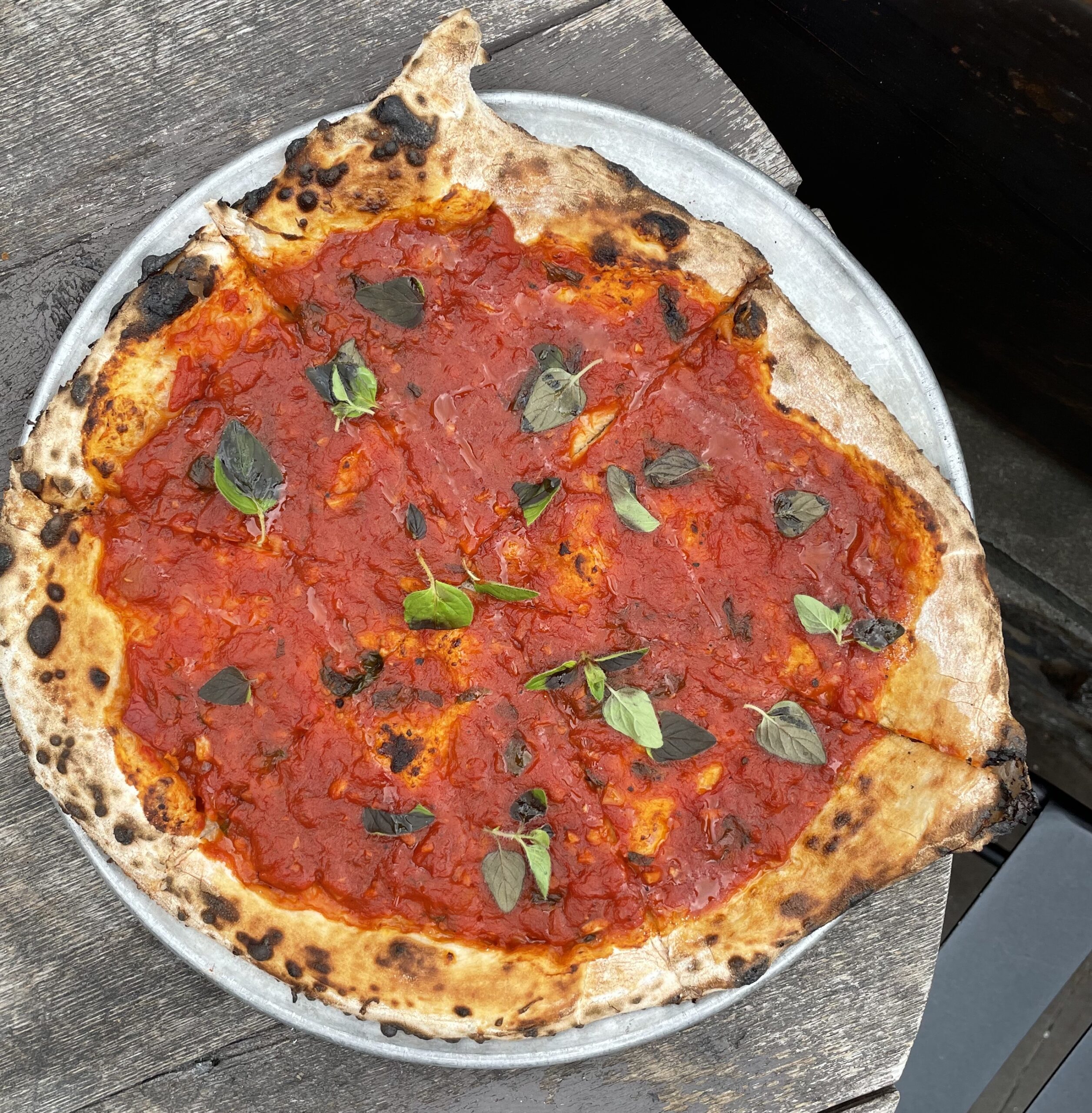 Rustic Tomato Pie, vegan pizza in Philadelphia, wood-fired pizza, slow cooked marinara sauce + fresh oregano + extra virgin olive oil